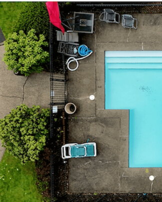 Community pool deck dark with grime