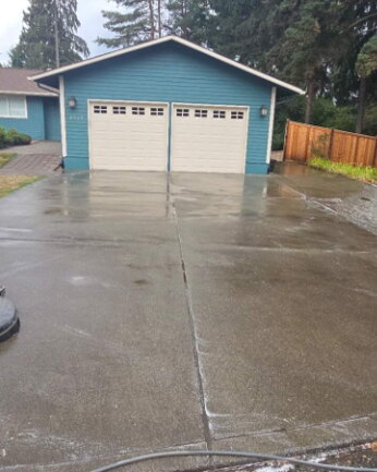 Concrete driveway dull with grime