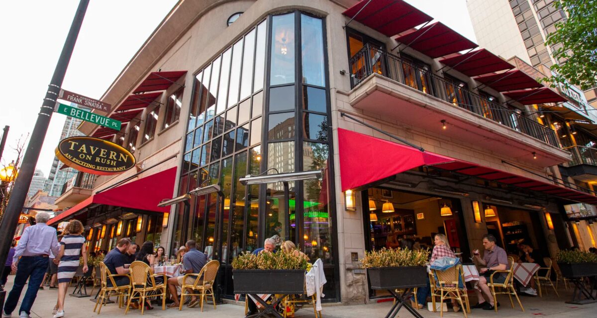 Bellevue restaurant brick and glass facade with red awnings