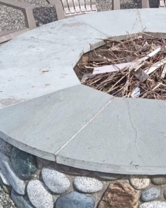 Same stone fire pit clean after pressure washing