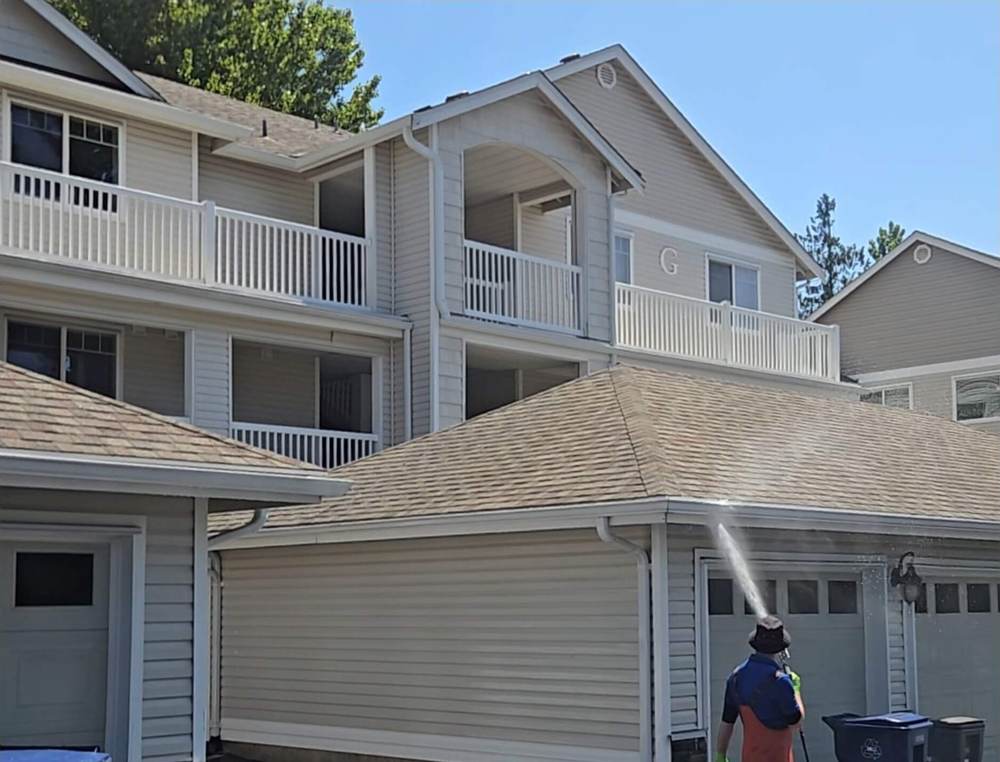 Deep Water technician soft washing a Redmond townhome