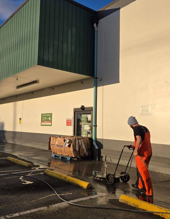 Deep Water technician cleaning the loading area of a warehouse